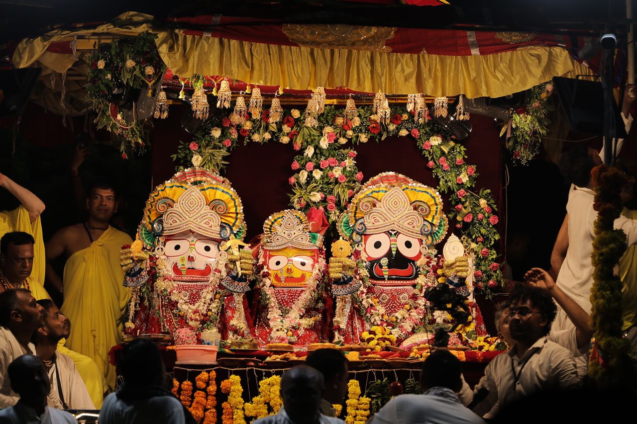 Home Colorful depiction of the Jagannath Rath Yatra festival with adorned deities and devotees.